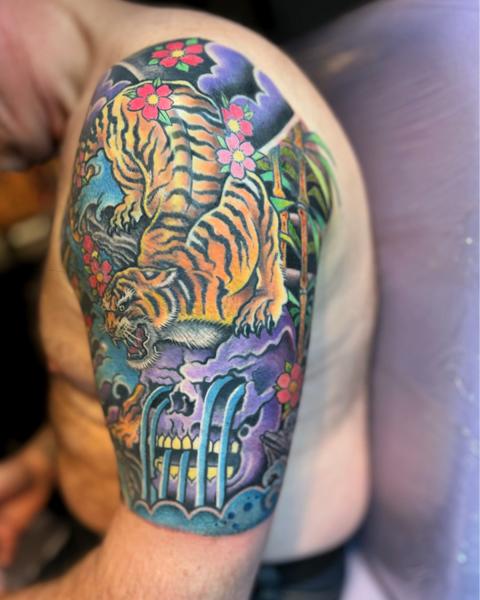 Japanese tiger and flowers tattoo by @the_dan_gold