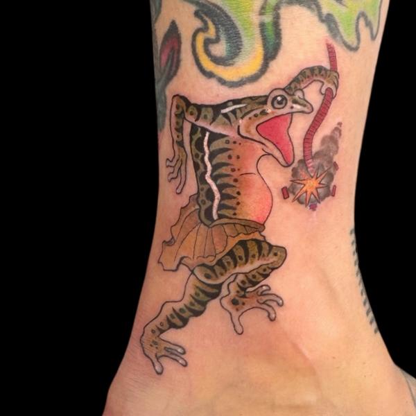 Traditional frog with firecracker tattoo by @the_dan_gold