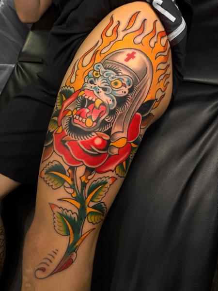 Traditional flaming gorilla rose tattoo by @broy_tattooer