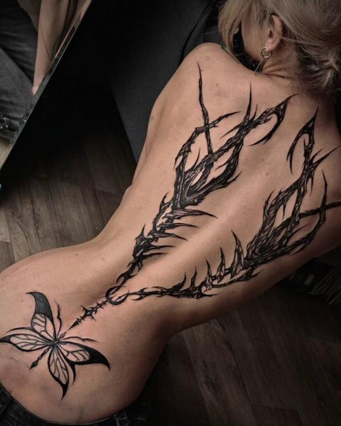Blackwork abstract butterfly tattoo by @inkeepertattooathens