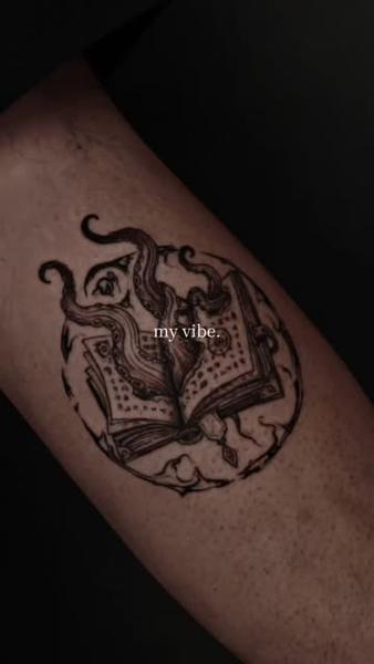 Illustrative magical book tattoo by @inkeepertattooathens