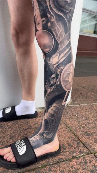 Biomechanical biomechanical skull tattoo by @tomftattoo