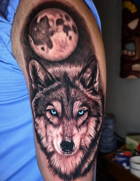 Realism wolf and moon tattoo by @tim_langer_tattoo