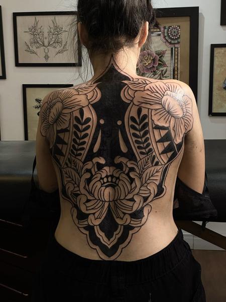 Blackwork ornamental floral tattoo by @titotattooart_