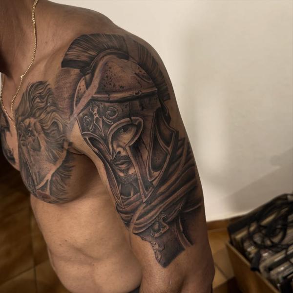 Realism spartan warrior tattoo by @titotattooart_