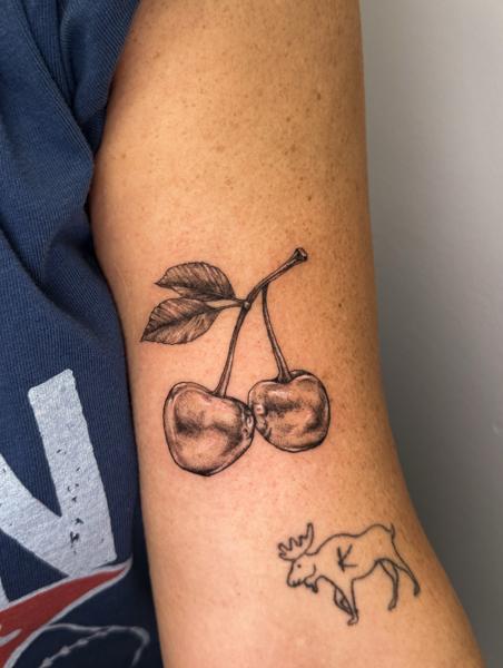 Realism cherry tattoo by @total_eclipse_tattoo