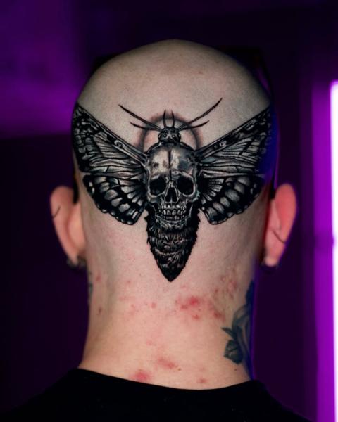 Blackwork moth skull tattoo by @nasufi_armando
