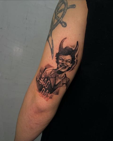 Blackwork devilish character tattoo by @zachosink