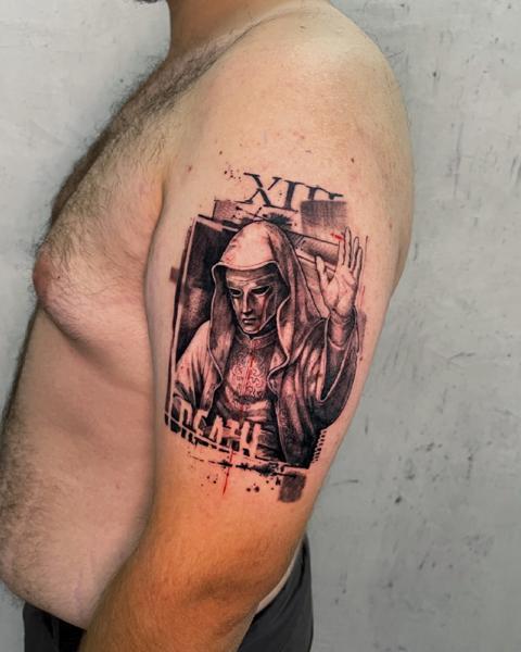 Realism hooded figure tattoo by @zachosink