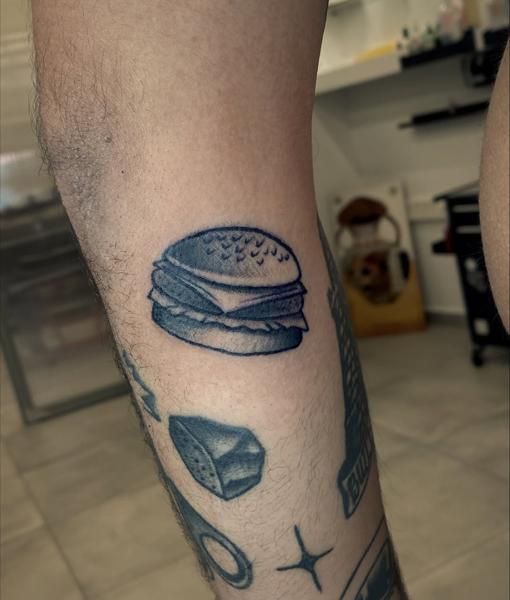 Illustrative burger tattoo by @usual_suspect_ttt