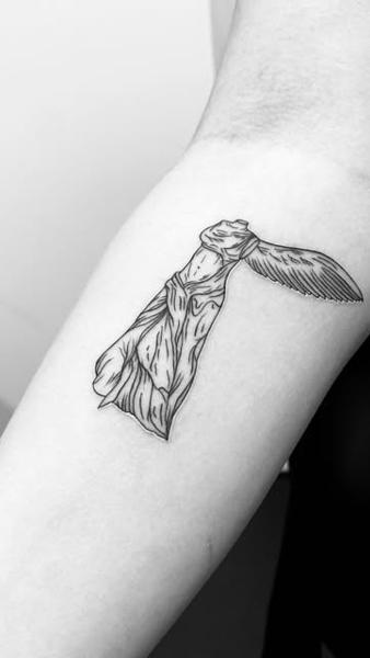 Fine line winged statue tattoo by @vanillaflows
