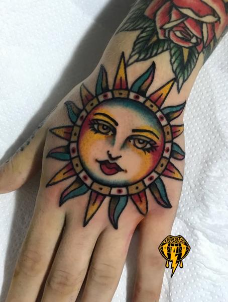 Traditional sun face tattoo by @vasso_lowbrow