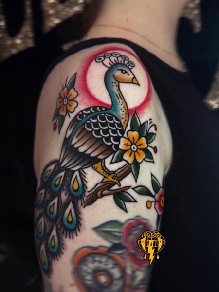 Traditional peacock tattoo by @vasso_lowbrow
