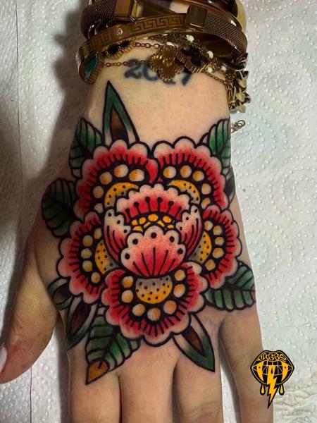 Traditional traditional flower tattoo by @vasso_lowbrow