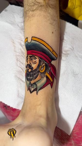 Traditional pirate portrait tattoo by @vasso_lowbrow