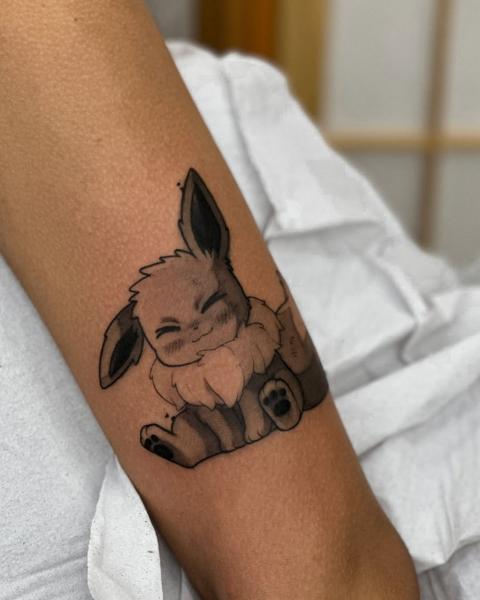 Anime eevee character tattoo by @vitoortattoo