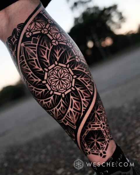 Blackwork geometric mandala tattoo by @weschetattoo