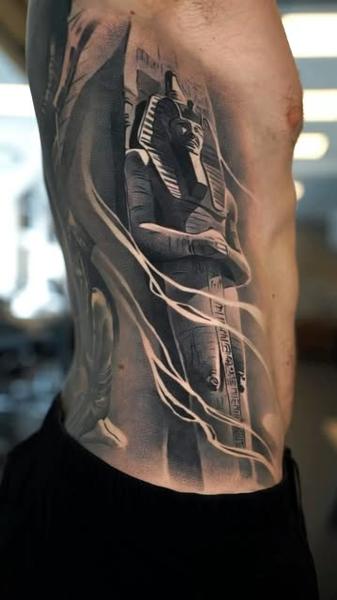 Realism pharaoh statue tattoo by @wilkendorftattoo