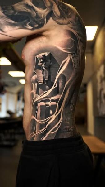 Realism pharaoh statue tattoo by @wilkendorftattoo