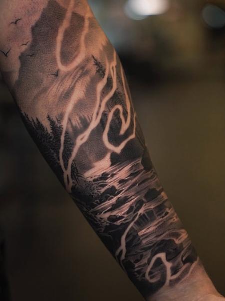 Illustrative stormy landscape tattoo by @wilkendorftattoo