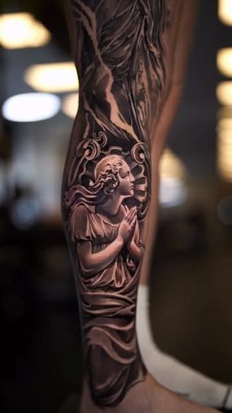 Realism praying figure tattoo by @wilkendorftattoo