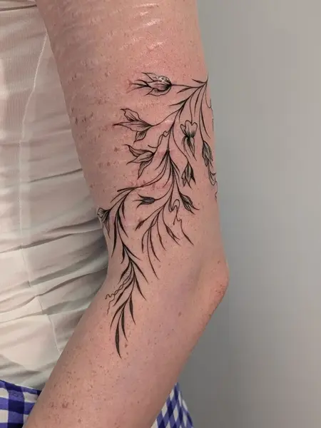 Fine line floral branch tattoo by @xia_smith_tattoo