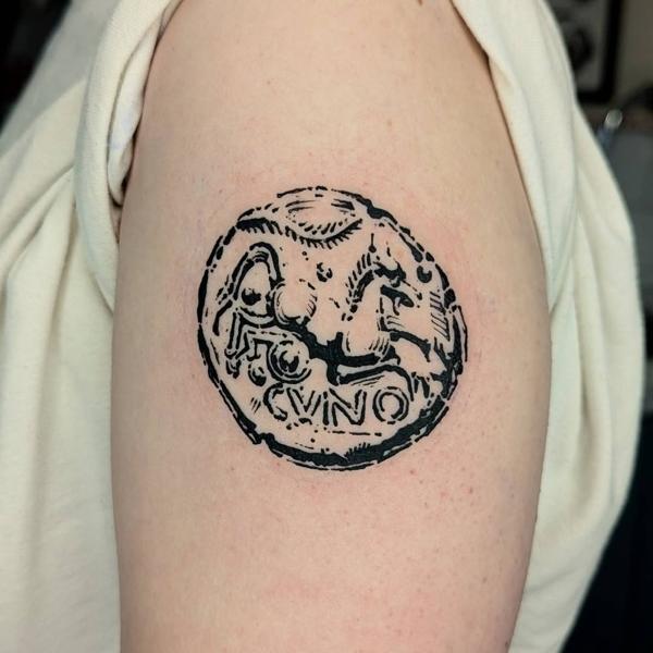 Linework ancient coin tattoo by @art.of.gold