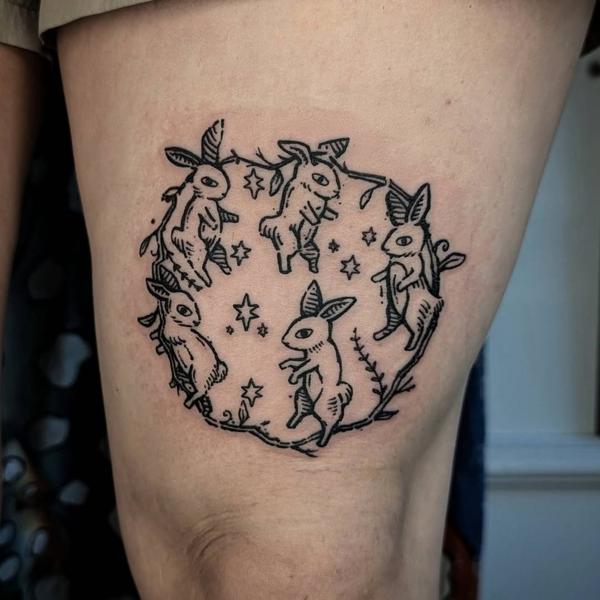 Linework dancing rabbits tattoo by @art.of.gold
