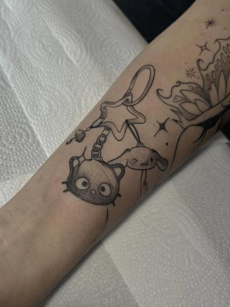 Anime cartoon keychain tattoo by @yasart.tattoo