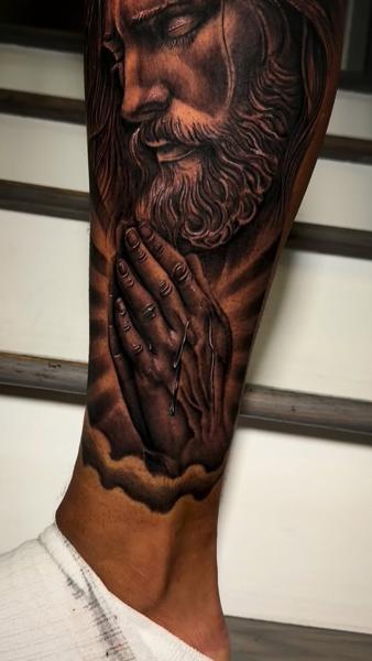 Realism praying hands tattoo by @zamor_art