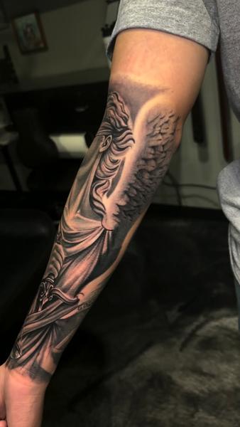 Realism angel statue tattoo by @zamor_art