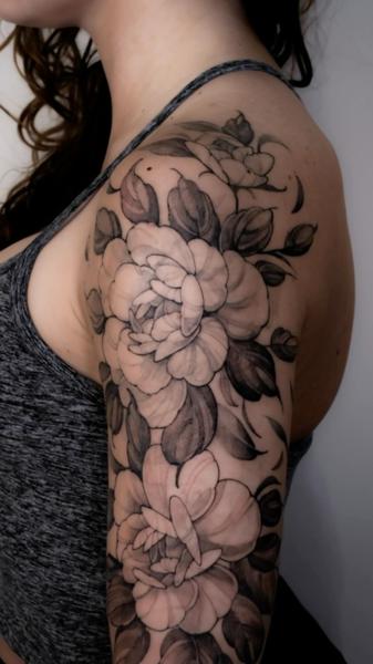 Black And Grey floral design tattoo by @zozutattoo