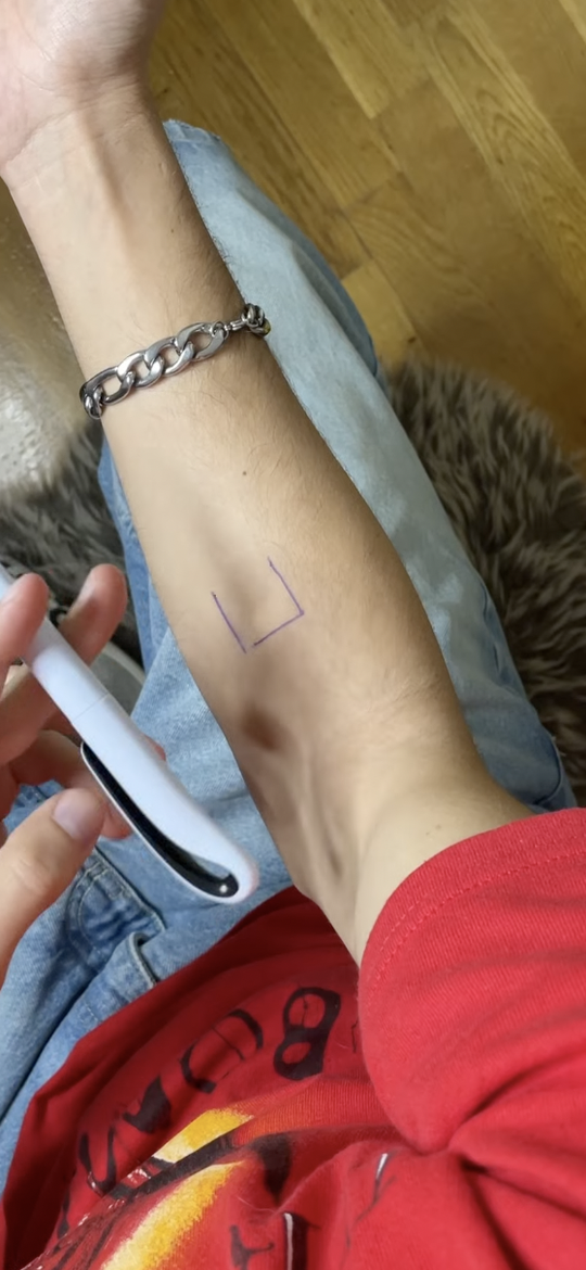 Inkjin AR view showing a tattoo design locked onto a forearm in real time